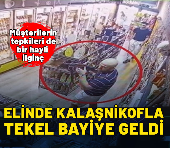 Elinde koskoca kalaşnikof ile tekel bayiye geldi! Vatandaşın tepkisi de bir hayli ilginç